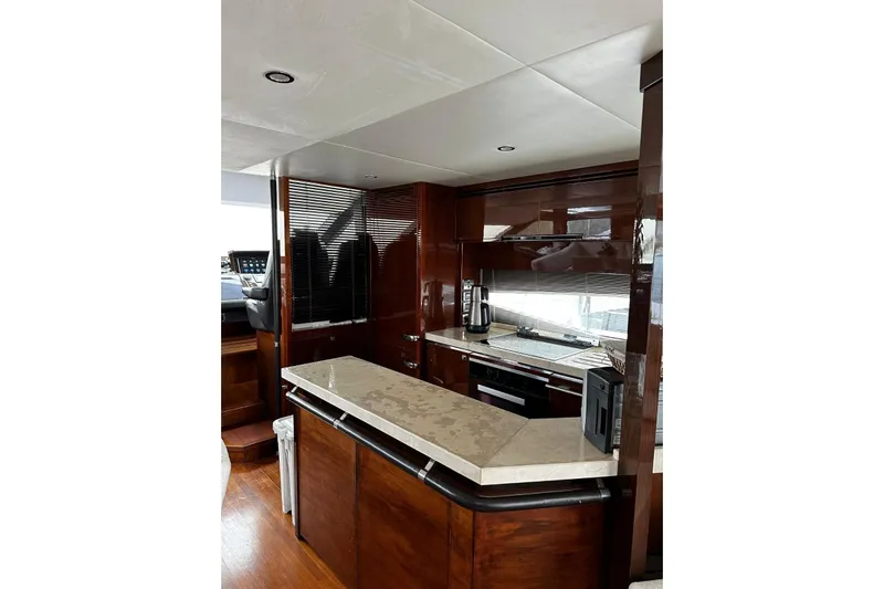  Yacht Photos Pics Luxurious kitchen interior of 2014 Princess 72 yacht with modern appliances and sleek design.