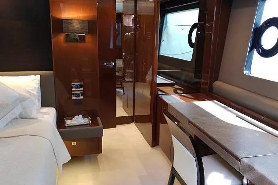  Yacht Photos Pics Luxurious interior of a 2014 Princess 72 yacht, featuring elegant wood finishes and modern design.
