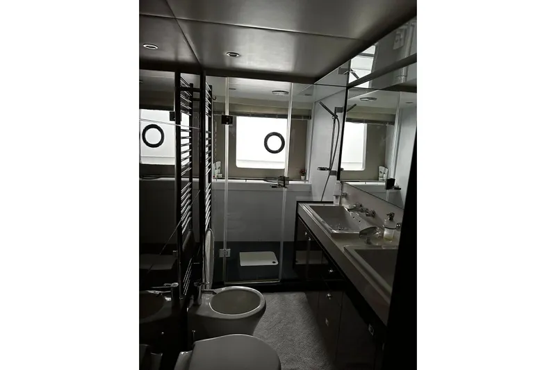 Yacht Photos Pics Luxurious bathroom in 2014 Princess 72 yacht with modern fixtures and elegant design.