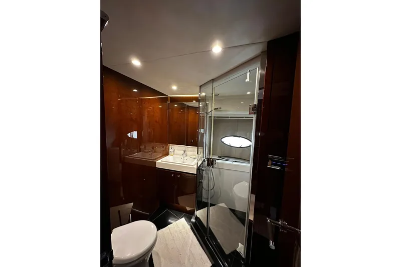  Yacht Photos Pics Luxurious bathroom in 2014 Princess 72 yacht with sleek design and modern fixtures.