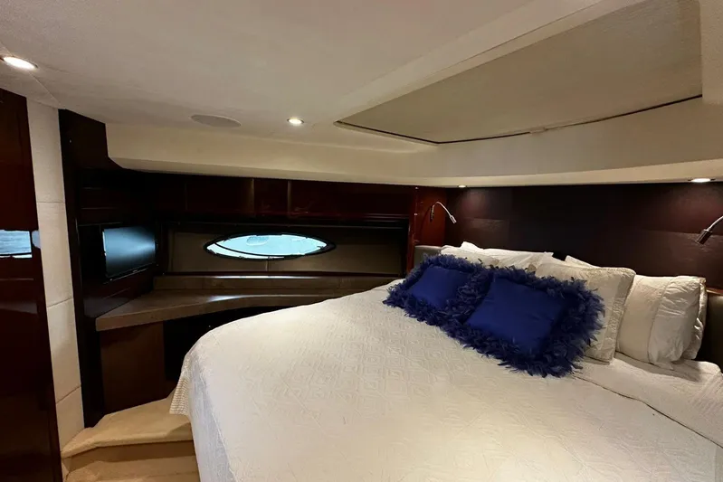  Yacht Photos Pics Luxurious bedroom interior of 2014 Princess 72 yacht with plush bedding and elegant design.