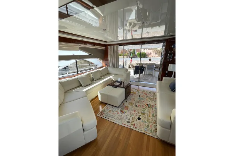  Yacht Photos Pics Luxurious interior of 2014 Princess 72 yacht with elegant white seating and decorative rug.