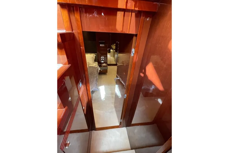  Yacht Photos Pics Luxurious interior of 2014 Princess 72 yacht with polished wood finish.