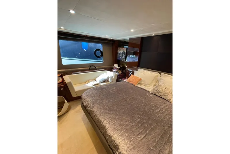  Yacht Photos Pics Luxurious bedroom interior of 2014 Princess 72 yacht with elegant bedding and seating.