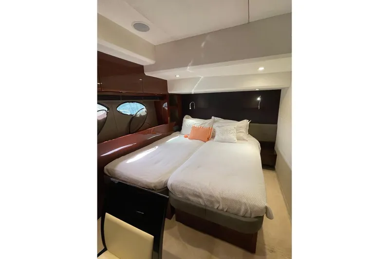  Yacht Photos Pics Luxurious cabin interior of 2014 Princess 72 yacht with twin beds and elegant decor.