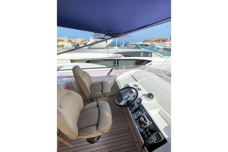  Yacht Photos Pics Luxurious 2014 Princess 72 yacht helm with leather seats and marina view.