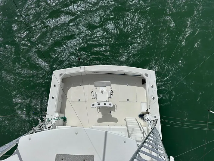  Yacht Photos Pics Bertram 50 Convertible 1990 yacht deck overlooking green ocean waters.