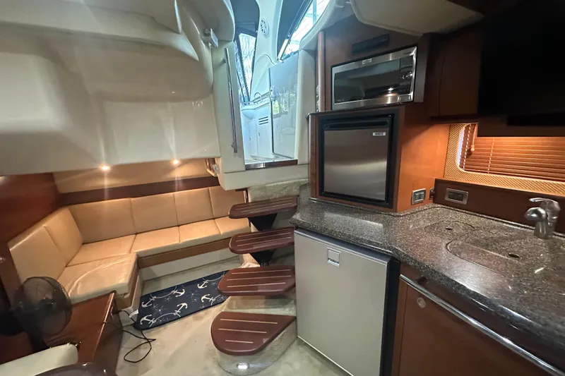  Yacht Photos Pics Luxurious 2007 Sea Ray 38 Sundancer yacht interior with kitchenette and seating area.