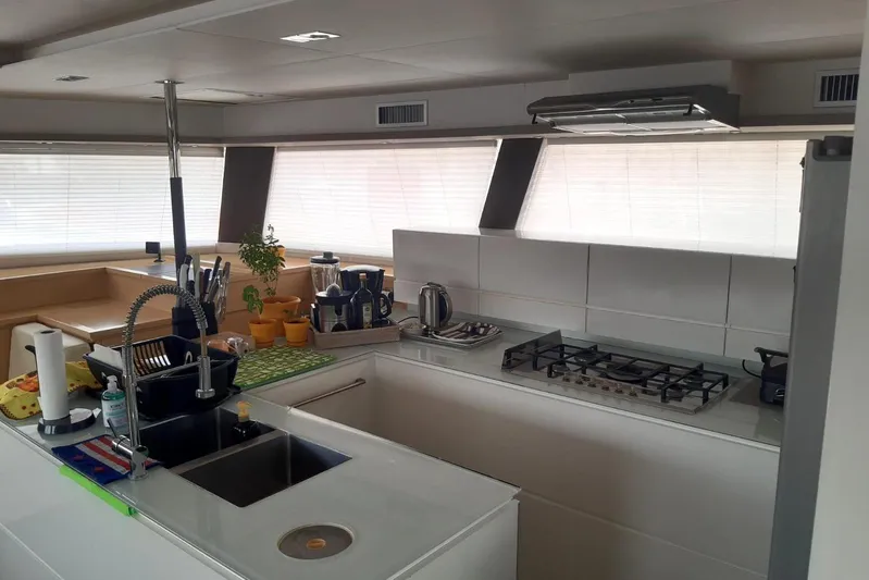 Sea Jade Yacht Photos Pics Modern kitchen interior on 2014 FONTAINE PAJOT 63 yacht with sleek design and appliances.