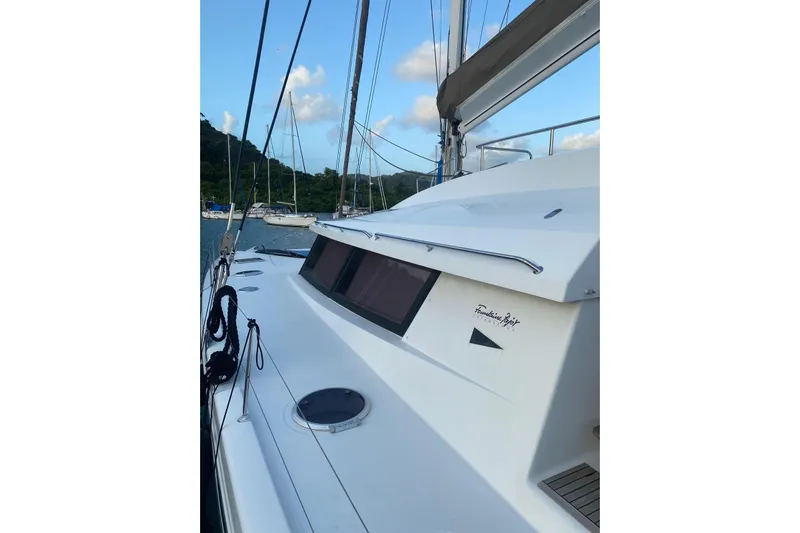 Sea Jade Yacht Photos Pics 2014 FONTAINE PAJOT 63 yacht docked, showcasing sleek design and modern features.