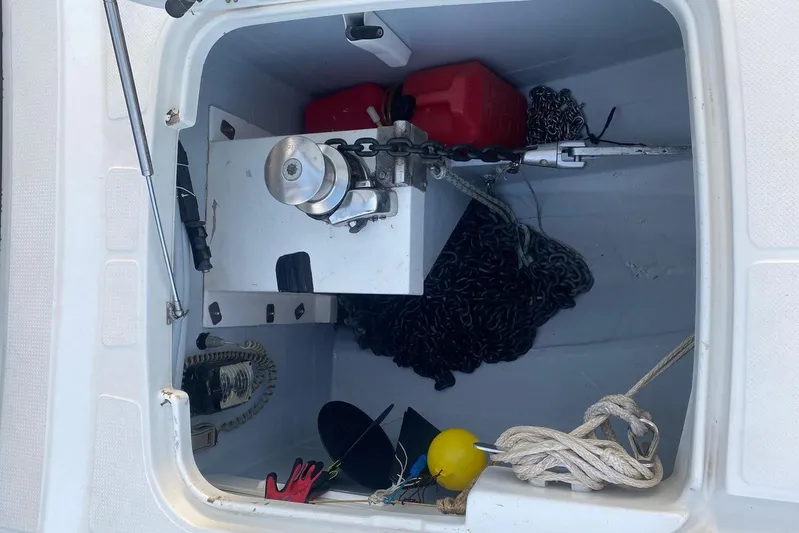 Sea Jade Yacht Photos Pics Anchor locker of 2014 FONTAINE PAJOT 63 with chains, ropes, and equipment.