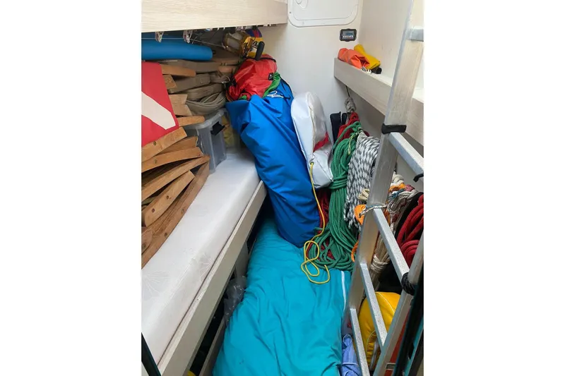 Sea Jade Yacht Photos Pics Storage area on 2014 FONTAINE PAJOT 63 yacht with ropes, ladder, and equipment.