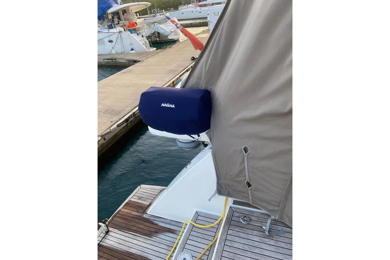 Sea Jade Yacht Photos Pics Docked 2014 FONTAINE PAJOT 63 yacht with covered equipment, featuring a Magma grill.