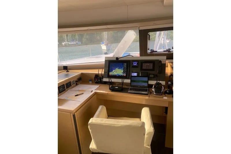 Sea Jade Yacht Photos Pics Navigation station of 2014 FONTAINE PAJOT 63 yacht with modern equipment and comfortable seating.