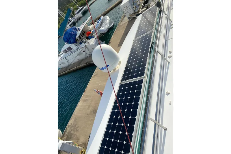 Sea Jade Yacht Photos Pics 2014 FONTAINE PAJOT 63 yacht with solar panels docked at marina.