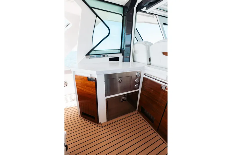 Phoenix Yacht Photos Pics Luxurious interior of 2023 Tiara 48 yacht with sleek cabinetry and modern design.