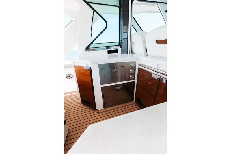 Phoenix Yacht Photos Pics Luxurious interior of 2023 Tiara 48 yacht with sleek cabinetry and modern design.
