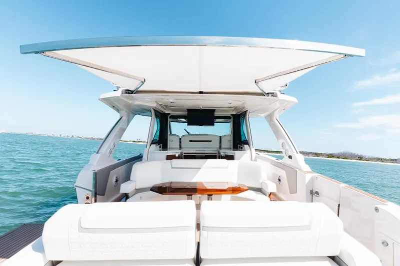 Phoenix Yacht Photos Pics Luxurious 2023 Tiara 48 yacht with spacious deck and modern design on open water.