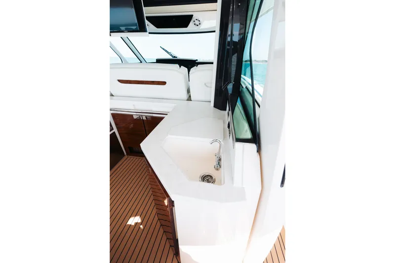 Phoenix Yacht Photos Pics 2023 Tiara 48 yacht interior with sleek sink and modern design.