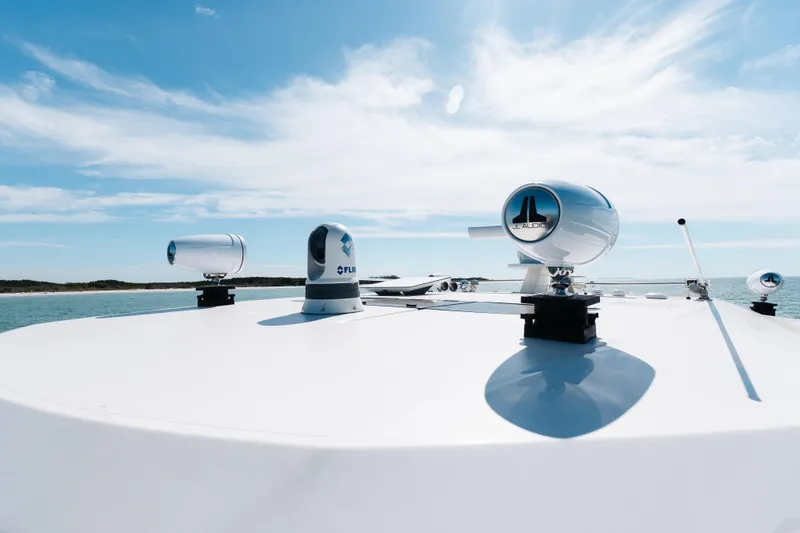 Phoenix Yacht Photos Pics 2023 Tiara 48 yacht with advanced audio and navigation systems under a clear sky.