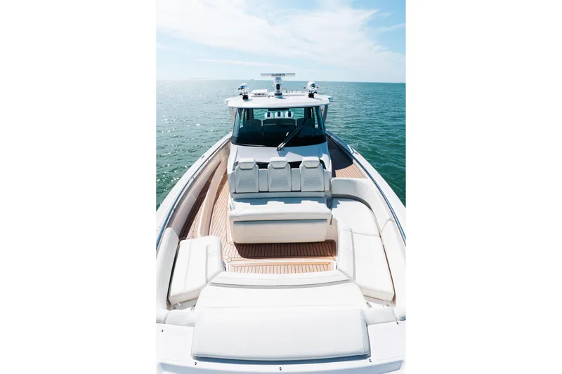 Phoenix Yacht Photos Pics 2023 Tiara 48 yacht on open water, showcasing luxurious deck seating.