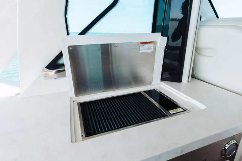 Phoenix Yacht Photos Pics Outdoor grill on 2023 Tiara 48 yacht, featuring sleek design and modern amenities.