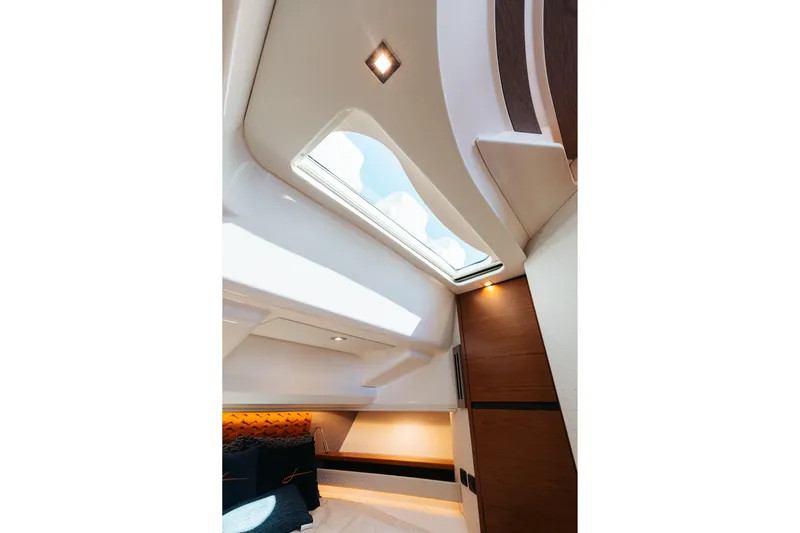 Phoenix Yacht Photos Pics Interior of 2023 Tiara 48 yacht, featuring a skylight and modern design elements.