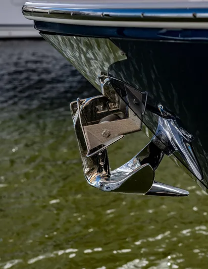 Syren Yacht Photos Pics Close-up of 2022 Regal 42 FXO boat anchor over water.
