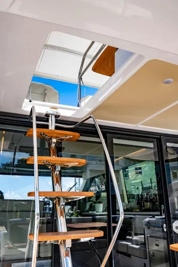 Syren Yacht Photos Pics Staircase on 2022 Regal 42 FXO yacht, leading to upper deck with modern design.