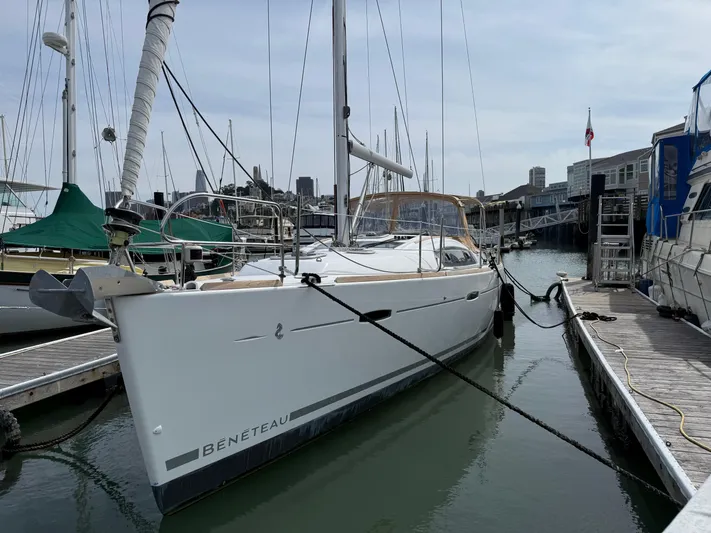 Deep Unreal Yacht Photos Pics 2008 Beneteau Oceanis 40 sailboat docked at a marina, surrounded by other boats.