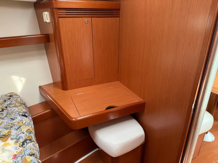 Deep Unreal Yacht Photos Pics Interior of 2008 Beneteau Oceanis 40 yacht with wooden cabinetry and cushioned seating.