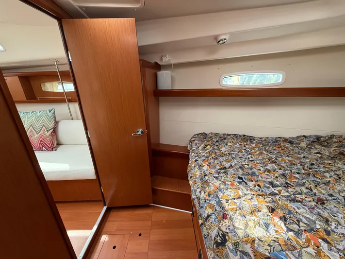 Deep Unreal Yacht Photos Pics Interior of 2008 Beneteau Oceanis 40 sailboat, featuring cozy cabin and wooden finishes.