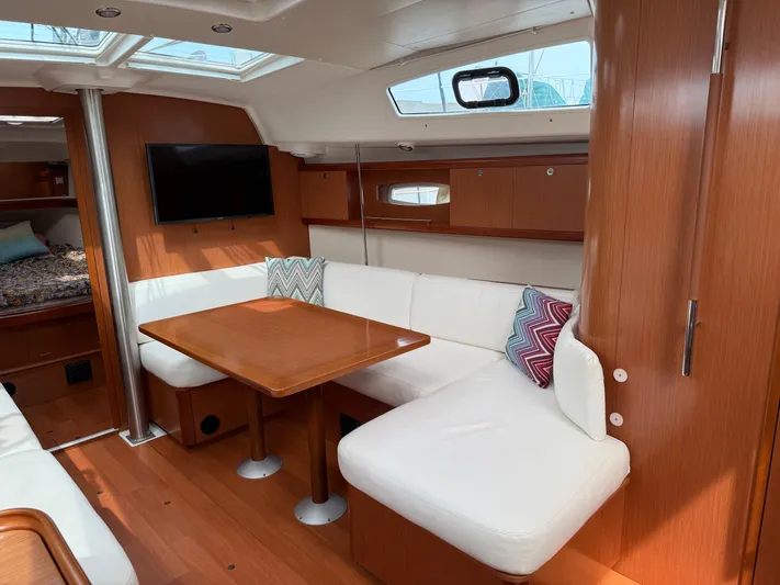 Deep Unreal Yacht Photos Pics Interior of 2008 Beneteau Oceanis 40 yacht with cozy seating and wooden finishes.