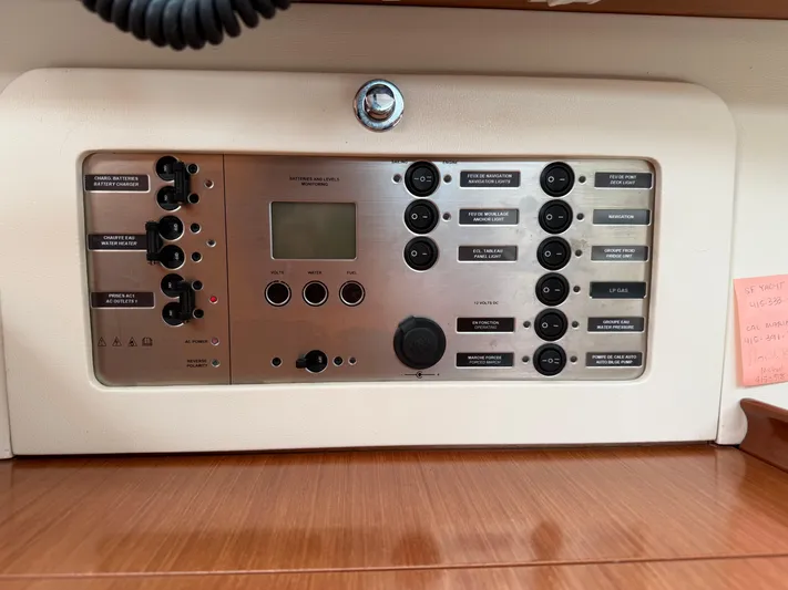 Deep Unreal Yacht Photos Pics Control panel of a 2008 Beneteau Oceanis 40 yacht, featuring various switches and indicators.