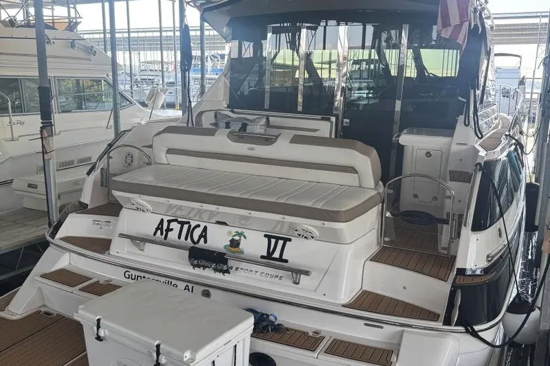  Yacht Photos Pics 2016 Regal 46 Sport Coupe yacht docked, featuring spacious seating and elegant design.