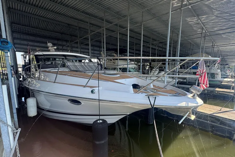  Yacht Photos Pics 2016 Regal 46 Sport Coupe yacht docked in covered marina.