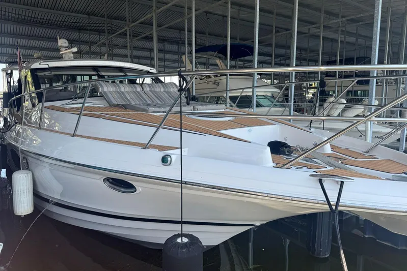  Yacht Photos Pics 2016 Regal 46 Sport Coupe yacht docked in a marina, showcasing sleek design and luxury features.