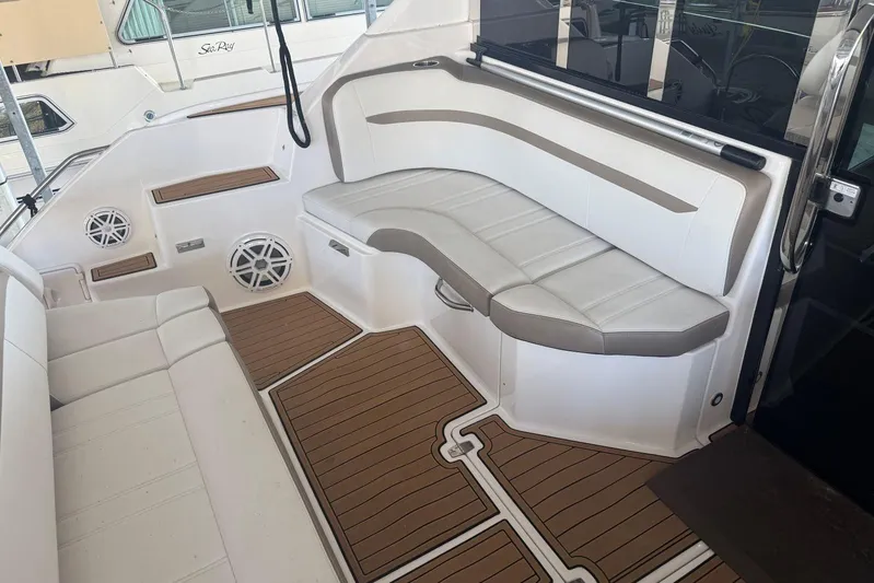 Yacht Photos Pics 2016 Regal 46 Sport Coupe interior with white seating and wood-style flooring.
