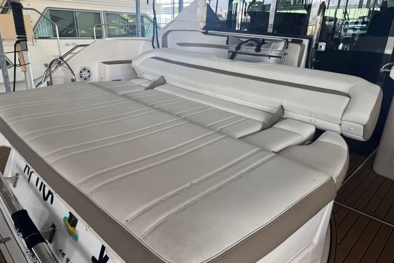  Yacht Photos Pics 2016 Regal 46 Sport Coupe yacht with spacious white leather seating area.