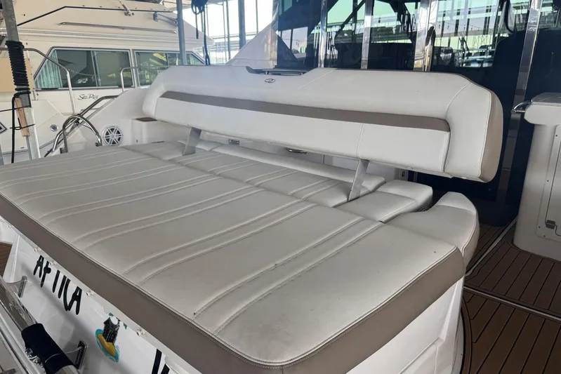  Yacht Photos Pics 2016 Regal 46 Sport Coupe yacht with white cushioned seating area.