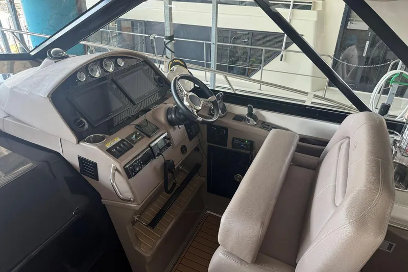  Yacht Photos Pics 2016 Regal 46 Sport Coupe helm with modern controls and comfortable seating.