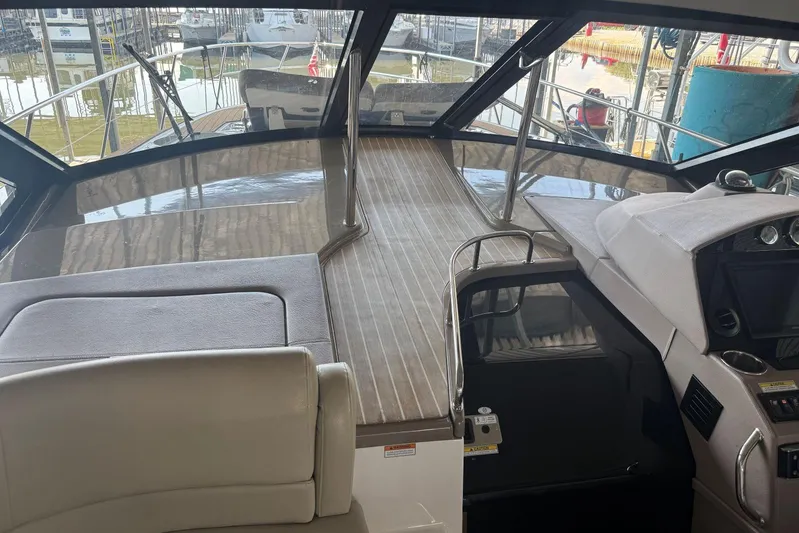  Yacht Photos Pics Interior view of 2016 Regal 46 Sport Coupe yacht, featuring sleek design and modern controls.