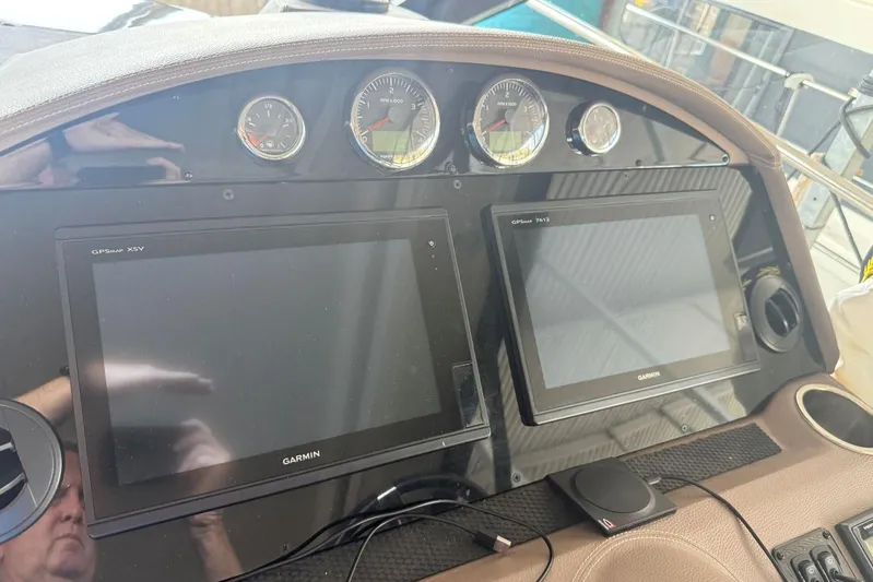  Yacht Photos Pics Dashboard of 2016 Regal 46 Sport Coupe with Garmin GPS displays and gauges.