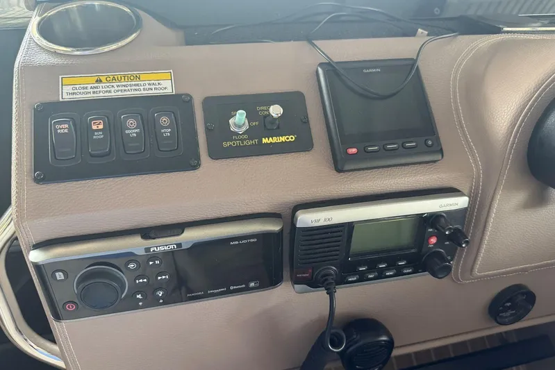  Yacht Photos Pics Control panel of a 2016 Regal 46 Sport Coupe with various navigation and communication devices.