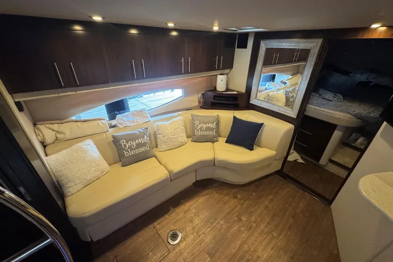  Yacht Photos Pics Luxurious interior of 2016 Regal 46 Sport Coupe with cozy seating and elegant decor.