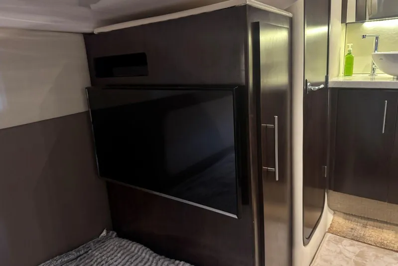  Yacht Photos Pics Interior of 2016 Regal 46 Sport Coupe featuring a mounted TV and modern cabinetry.