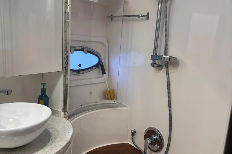  Yacht Photos Pics Bathroom interior of 2016 Regal 46 Sport Coupe yacht with shower and sink.