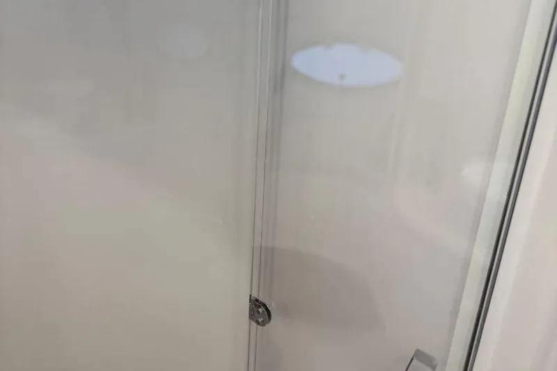  Yacht Photos Pics Frosted glass door detail on 2016 Regal 46 Sport Coupe yacht.