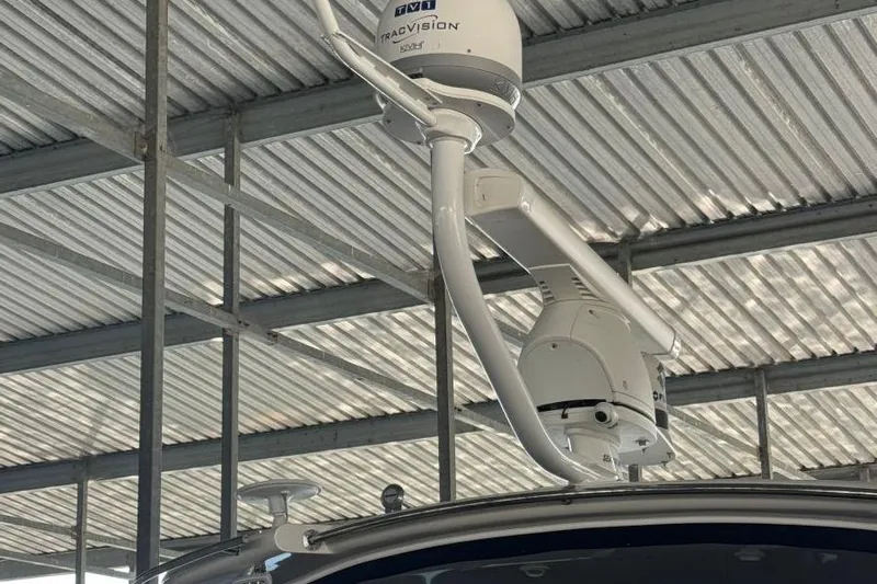  Yacht Photos Pics Satellite equipment on 2016 Regal 46 Sport Coupe under metal roof.