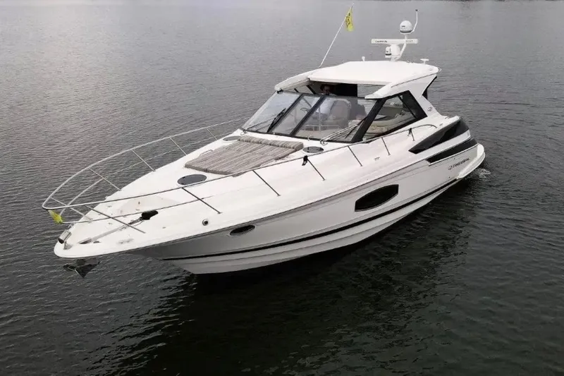  Yacht Photos Pics 2016 Regal 46 Sport Coupe yacht cruising on calm waters.